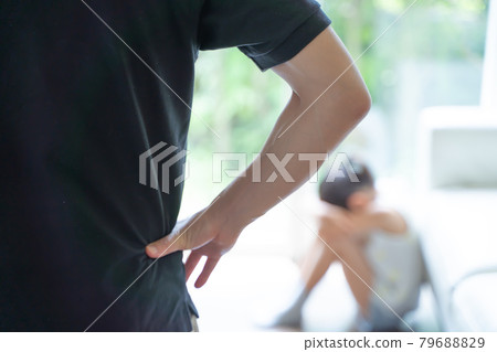 A girl crouching and crying, and adults watching her 79688829