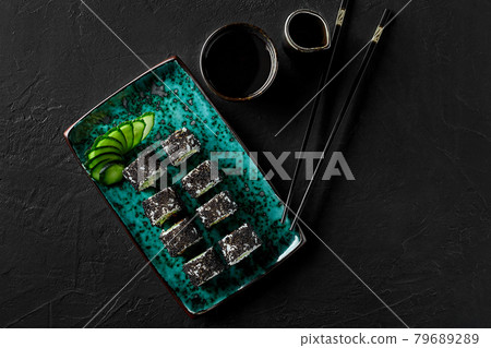 Shrimp California roll in tobiko with cucumber and soy sauce 79689289