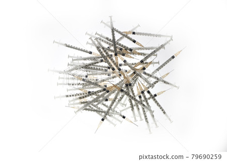 A pile of syringesA pile of syringes 79690259