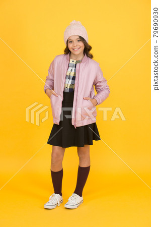 Clothes shop. Cool girl. Happy child yellow background. Clothes shop. Cool girl. Happy child yellow background. 79690930