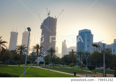 Alley with green lawn and trees in the Zabeel park 79691282