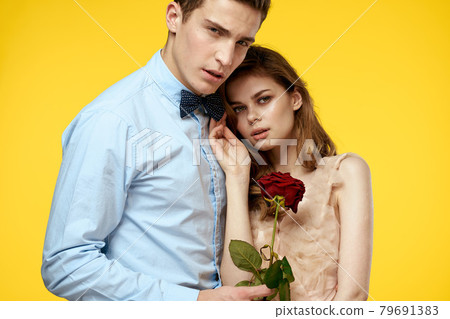 romantic couple in love with red flower hugging each other cropped view Copy Space romantic couple in love with red flower hugging each other cropped view Copy Space 79691383