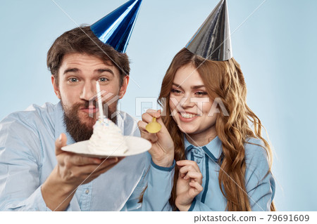 Birthday corporate young man and woman with cake on isolated background disco party 79691609