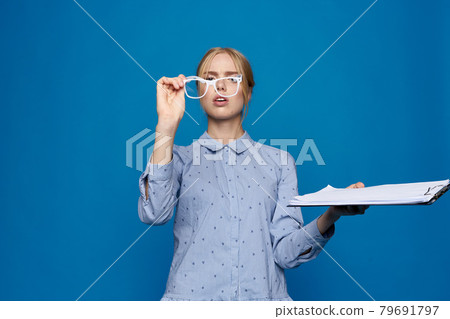 business woman blonde in glasses with documents work blue shirt 79691797
