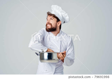 male chef preparing food in a saucepan kitchen professional male chef preparing food in a saucepan kitchen professional 79691998