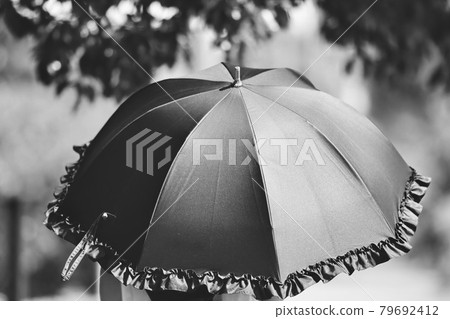 Woman with a parasol Woman with a parasol 79692412