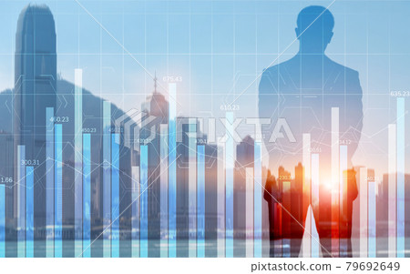 Double exposure blue chart financial graphs and diagrams 79692649