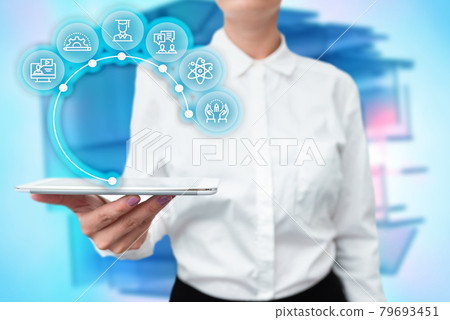 Lady In Uniform Standing Holding Tablet In Hand Presenting Virtual Modern Technology. Business Woman Carrying Tab Pointing For New Futuristic Tech. 79693451