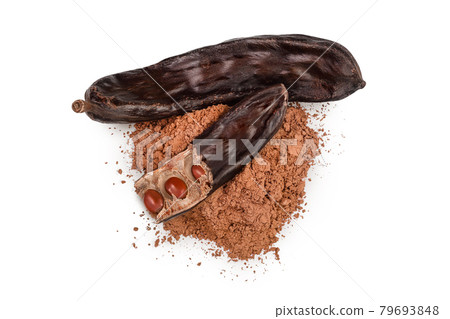 Carob pod and powder isolated on white background with clipping path and full depth of field. Top view. Flat lay Carob pod and powder isolated on white background with clipping path and full depth of field. Top view. Flat lay 79693848