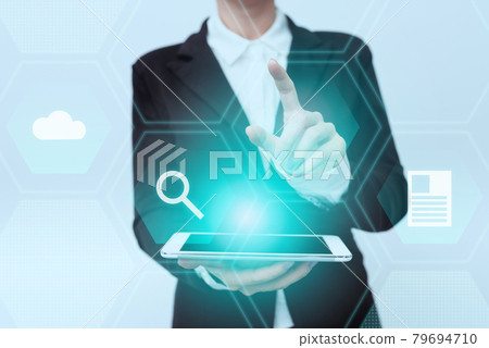 Woman In Uniform Standing Carrying Phone Pointing On Virtual Interface Display Icons. Lady In Suit Holding Mobile Device Points Towards Innovative Icon Designs. Woman In Uniform Standing Carrying Phone Pointing On Virtual Interface Display Icons. Lady In Suit Holding Mobile Device Points Towards Innovative Icon Designs. 79694710