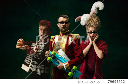 Portraits of medieval people as a royalty persons in vintage clothing on dark background. Concept of comparison of eras, modernity and renaissance, baroque style. Portraits of medieval people as a royalty persons in vintage clothing on dark background. Concept of comparison of eras, modernity and renaissance, baroque style. 79695612