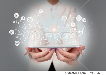 Lady In Uniform Standing Holding Tablet And A Pen Displaying Holographic Tech. Woman In Suit Carrying A Touchpad Showing New Futuristic Interface Technologies. Lady In Uniform Standing Holding Tablet And A Pen Displaying Holographic Tech. Woman In Suit Carrying A Touchpad Showing New Futuristic Interface Technologies. 79695619