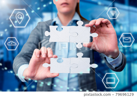 Business Woman Holding Jigsaw Puzzle Piece With Two Hands Unlocking New Futuristic Technologies. Palm Carrying Puzzles Part Displaying Solving Late Innovative Virtual Ideas. 79696129