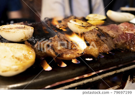 Juicy beef ribs grilled at a traditional yakiniku restaurant Juicy beef ribs grilled at a traditional yakiniku restaurant 79697199