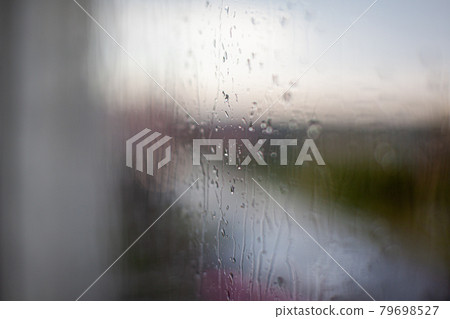 Rainy day through the window on sky and city buildings background 79698527