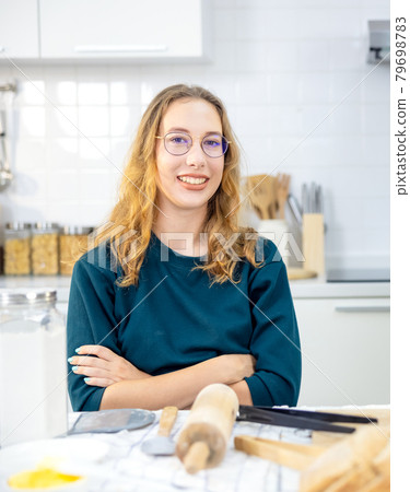 portrait Beautiful Woman With tools made Baked Breads in kitchen portrait Beautiful Woman With tools made Baked Breads in kitchen 79698783