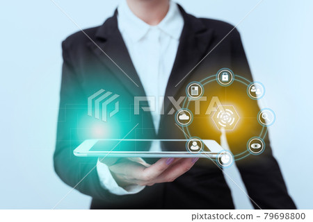 Woman In Suit Standing Holding Device Displaying Digital Virtual Interface. Lady In Uniform Presenting Mobile Phone Showing Futuristic Technologies Display Woman In Suit Standing Holding Device Displaying Digital Virtual Interface. Lady In Uniform Presenting Mobile Phone Showing Futuristic Technologies Display 79698800