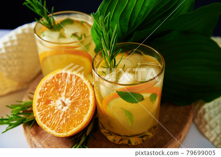 Orange fresh lemonadewith rosemaru in glass on table 79699005