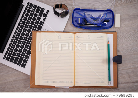 Opened Empty Notepad Over A Laptop With Compass Pen Wristwatch. Blank Open Lined Notepad Placed Next Computer Pencil Watch On Office Desk. Opened Empty Notepad Over A Laptop With Compass Pen Wristwatch. Blank Open Lined Notepad Placed Next Computer Pencil Watch On Office Desk. 79699295