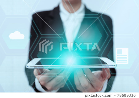 Lady In Uniform Standing Holding Touchpad With Two Hands Showing Futuristic Interface. Woman In Suit Carrying Tablet Displaying Modern Virtual Technology. 79699336