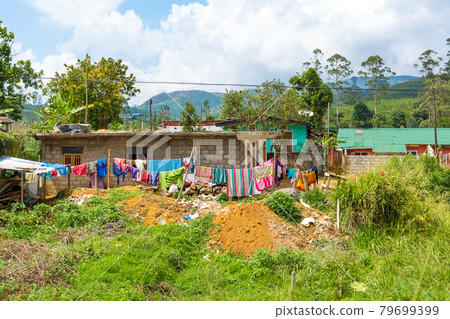 Poor dilapidated houses of the inhabitants of the island of Sri Lanka. Jungle lodging Poor dilapidated houses of the inhabitants of the island of Sri Lanka. Jungle lodging 79699399