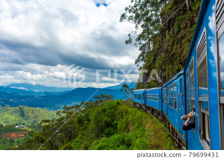 Travel by public train around the island of Sri Lanka. The train travels through mountains and tea plantations. Scenic railway Travel by public train around the island of Sri Lanka. The train travels through mountains and tea plantations. Scenic railway 79699431