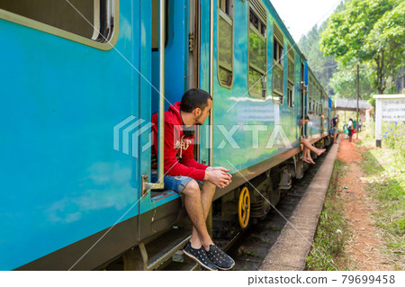 Travel by train in Sri Lanka. A very slow train with no doors. Picturesque places of the island Travel by train in Sri Lanka. A very slow train with no doors. Picturesque places of the island 79699458