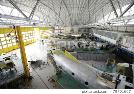 Maintenance hall with planes standing in aircraft fixtures for repair. The State Aircraft Repair Plant 79701607