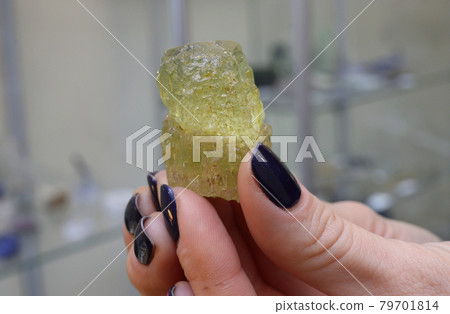 Clouse-up of yellow beryl mineral found in Europe in Norway 79701814