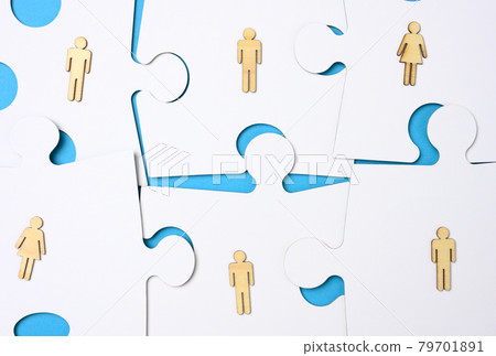 white puzzles and wooden men. Recruitment concept, team compatibility, individuality of each white puzzles and wooden men. Recruitment concept, team compatibility, individuality of each 79701891