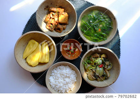 Vietnamese vegan food, rice bowl, fried aubergine, seitan cook with sauce, spinach soup 79702682