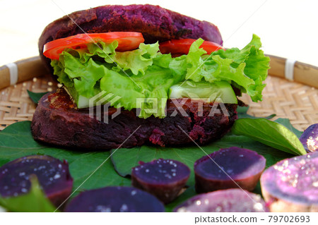 vegan hamburger from violet sweet potato with tomato, salad vegan hamburger from violet sweet potato with tomato, salad 79702693