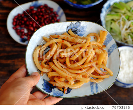 woman hand hold vegan food, plate of copra fried and cook with chili paste so delicious for vegetarian daily meal woman hand hold vegan food, plate of copra fried and cook with chili paste so delicious for vegetarian daily meal 79703126
