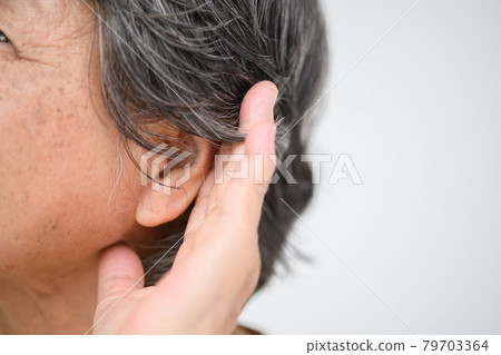 Senior woman ear Senior woman ear 79703364