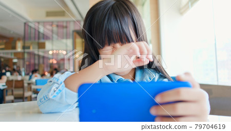 asian girl feel eye pain 79704619