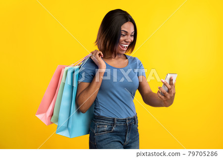 Excited Black Lady Making Selfie Posing With Shopper Bags, Studio 79705286