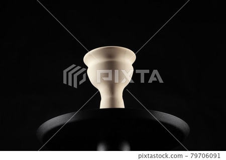 Ceramic tobacco bowl of hookah on black background Ceramic tobacco bowl of hookah on black background 79706091