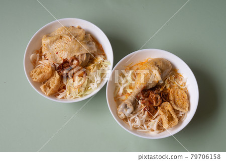Traditional Asian meal spicy Laksa noodle white curry soup with chicken from Malaysia or Singapore Traditional Asian meal spicy Laksa noodle white curry soup with chicken from Malaysia or Singapore 79706158
