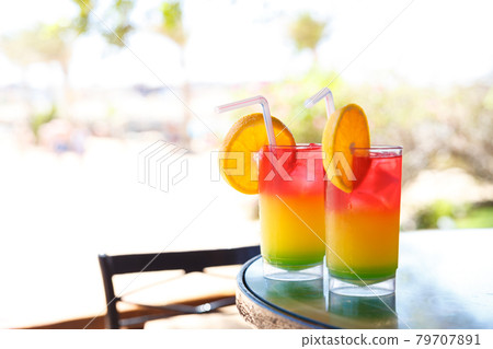 Two glasses with colorful cocktail 79707891
