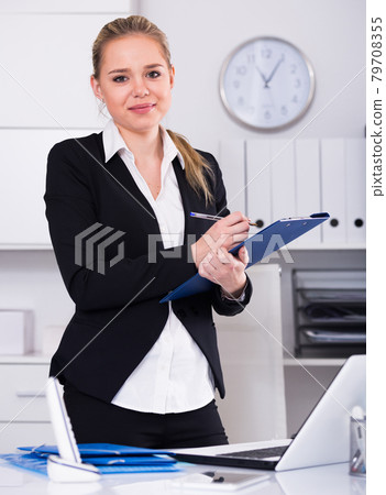 Female assistant noting tasks Female assistant noting tasks 79708355
