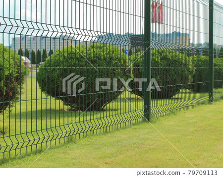 neat fence around the parking lot in the city neat fence around the parking lot in the city 79709113