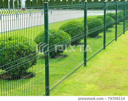 neat fence around a private area outside the city 79709114