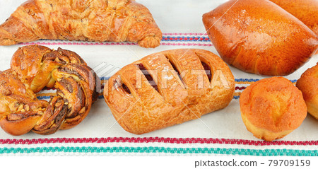 sweet pastries on rustic napkin background. Wide photo. sweet pastries on rustic napkin background. Wide photo. 79709159