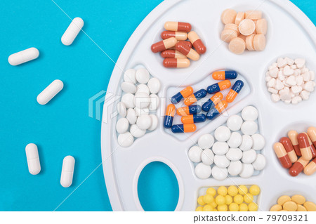 Pharmaceutical Industry and Medicinal Products - Different Colored Pills Pharmaceutical Industry and Medicinal Products - Different Colored Pills 79709321