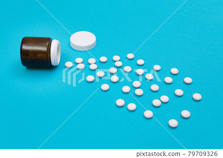 Pharmaceutical Industry and Medicinal Products - White Pills on Blue Background Pharmaceutical Industry and Medicinal Products - White Pills on Blue Background 79709326