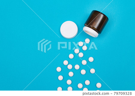 Pharmaceutical Industry and Medicinal Products - White Pills on Blue Background Pharmaceutical Industry and Medicinal Products - White Pills on Blue Background 79709328