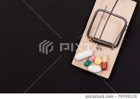 Pills in Wooden Mousetrap - Pharmaceutical Addiction 79709329