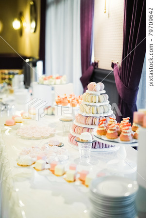 Delicious wedding reception candy bar dessert table Delicious wedding reception candy bar dessert table 79709642