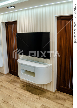 Modern furniture in a minimalist design executed in white color in a home interior. Modern furniture in a minimalist design executed in white color in a home interior. 79709677