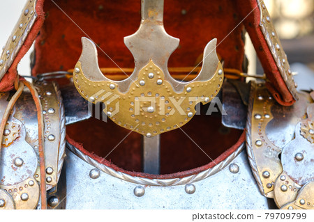 An ancient Knight's helmet with armor.A medieval concept An ancient Knight's helmet with armor.A medieval concept 79709799